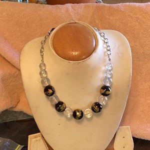 Women black and clear necklace with matching earrings